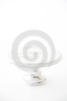 Handmade wooden cake plate. Craft and hobby concept. Object on a white background