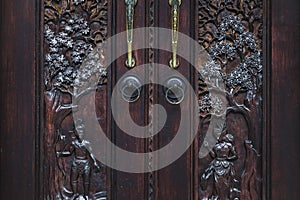 Handmade wooden carving door. Vintage old furniture in Bali style