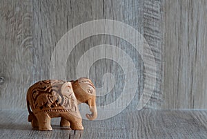Handmade wooden indian elephant on the shelf, carved elephant souvenir, wood elephant