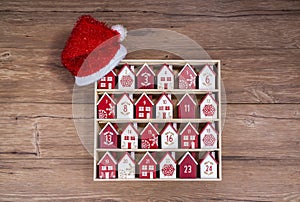 wooden perpetual calendar in a form of a house with christmas hat