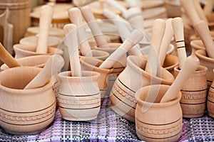 Handmade wooden pounder, pestle handicraft market photo