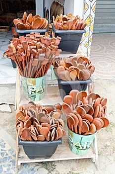 Handmade wooden spoons grouped together and sold at a handicraft fair in Brazil.