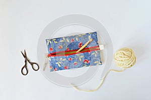 Handmade zipper pouch, crochet hook, yellow yarn and scissors