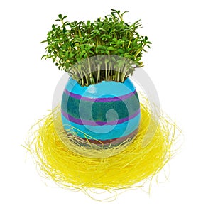 Handpainted Easter egg in multicolored patterns and decors in a