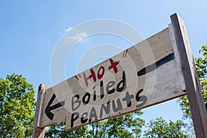 Handpainted Festival Sign Points Toward Sale Of Hot Boiled Peanuts