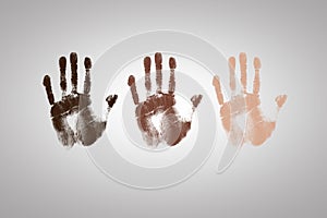 Handprint with different colors representing skin colors and ethnicity showing diversity and multiculturalism photo