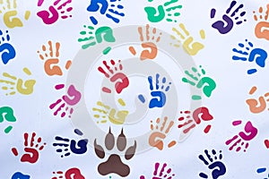 Handprints of children of different colors on a white background