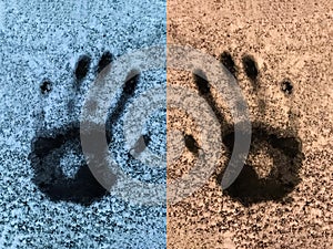 Handprints on the snowy ice. Blue and yellow abstraction background with palm footprints