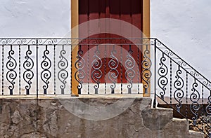 Handrail grid and old door in historical city of Serro, Minas Gerais photo