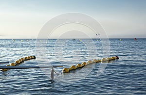 Handrails on beach for disabled people with ship at bottom in th photo