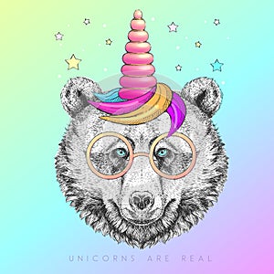 Handrawing animal bear wearing cute glasses with unicorn horn. T-shirt graphic print. photo