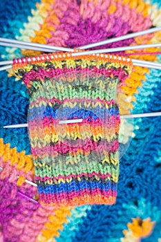 Handrcrafted colorful rainbow scarf beginned to knitting above