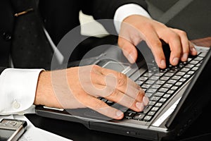 Hands above the keyboard laptop