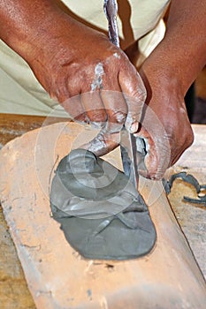 Afro-Ecuadorian hands making a mask photo