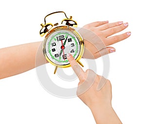 Hands and alarm clock like a watch