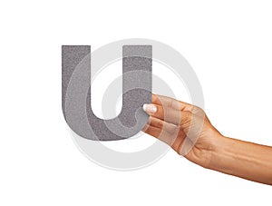 Hands, alphabet and capital letter U in studio isolated on a white background. Fingers, font and closeup of sign for