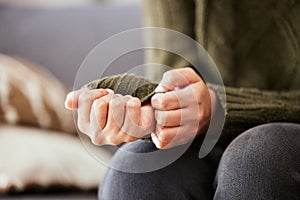 Hands, anxiety and closeup of a woman with depression, mental health problem and stress in home lounge. Female person on