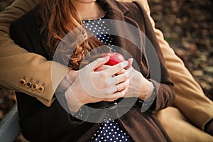 Hands with apple