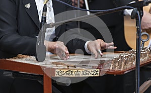 Hands and Arabian Qanon Musical Instrument photo
