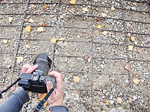 Hands of artist working with modern camera. Artist create