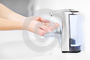Hands and automatic soap dispenser