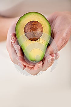 Hands, avocado and vegetable diet for antioxidants, nutrition and minerals or vitamins for health. Closeup, person and