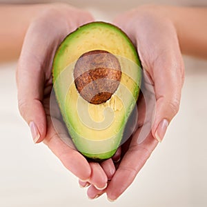 Hands, avocado and vegetable diet for wellness, health and minerals or antioxidants for nutrition. Closeup, person and