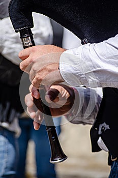 hands of a bagpiper playing his instrument, music concept