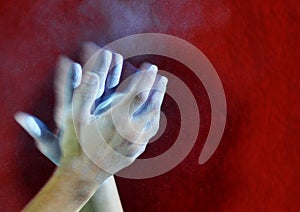Hands with a ball of powder chalk magnesia photo