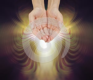 Hands Bathed in a Resonating Golden Healing Energy Field photo
