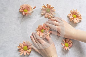 Hands of a beautiful woman on a white background. Delicate palm with natural manicure, clean skin. Light white nails. Hand Care