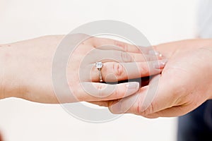 Hands with betrothal ring