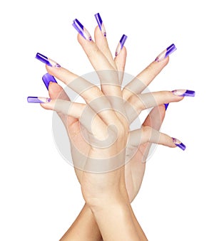 Hands with blue french acrylic nails manicure and painting