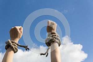 Hands bound by rope photo