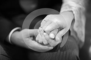 Hands of bride and bridegroom in wedding marriage ceremony