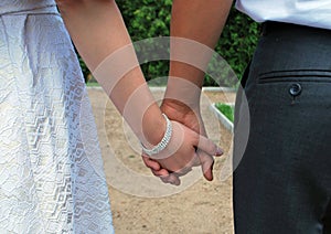 Hands of the bride and groom