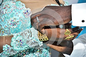 Hands of the bride and groom with gold on the fingers at the festival Hina, Israel 2016