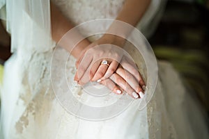 Hands of bride on wedding day