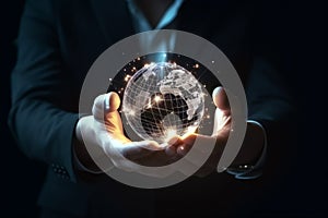 Hands of a business man holding illuminated earth planet with a concept of a global business communication network, Digital