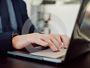 Hands, business man and laptop keyboard for planning research, data information or administration. Closeup, corporate