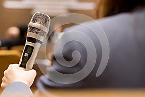 Hands business people holding microphones for speech