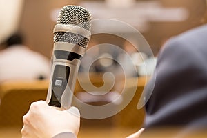 Hands business people holding microphones for speech