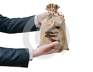 Hands of businessman holds bag full of money with Euro sign.