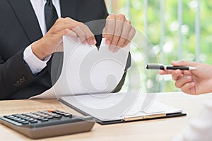 Hands of businessman ripping agreement paper when woman giving a