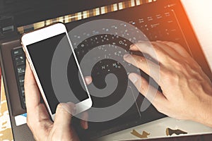 Hands of a businessman typing on a computer or laptop keyboard a