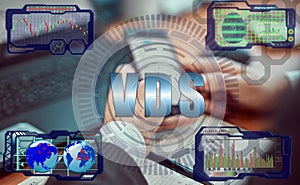 Hands of a businessman using a laptop with smart phone and futuristic holographic screen in the graphs of the exchange rate and photo