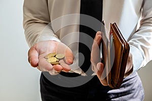 The hands of businessmen holding coins and wallets to save money, expand a growing business to success and save for retirement