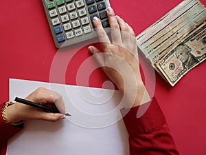 hands of a businesswoman counting american dollars banknotes