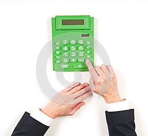 Hands businesswoman and green calculator