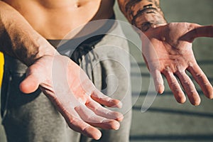 Hands with callus of a young calisthenics sportman photo